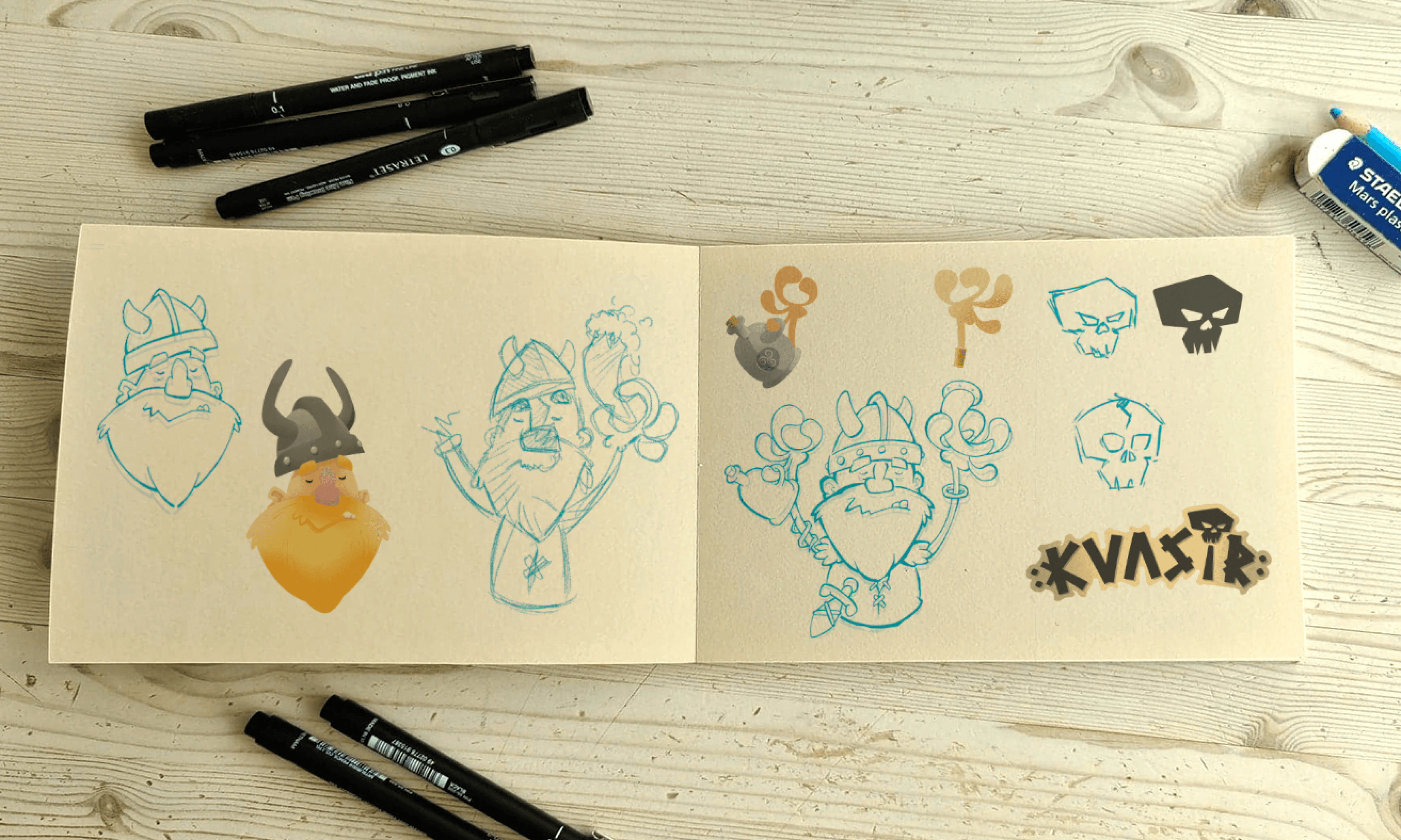 Open sketchbook with ink character sketches for Kraken, Battle, Helwater and Wolf